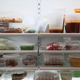 Refrigerator full of packaged leftovers